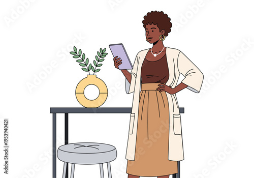 Woman standing and using a tablet next to a table
