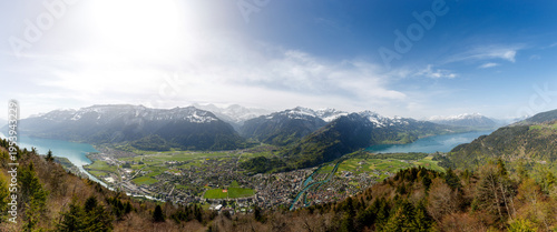 Fotografie Interlaken, situated between Lake Brienz and Lake Thun, as seen from Harder Kulm