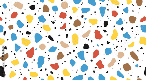Vibrant terrazzo floor pattern with scattered colorful stone chips in blue, yellow, red, orange, and brown on white.
