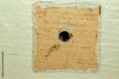 Photography Damaged surface with a hole in old paper texture background for design and conce