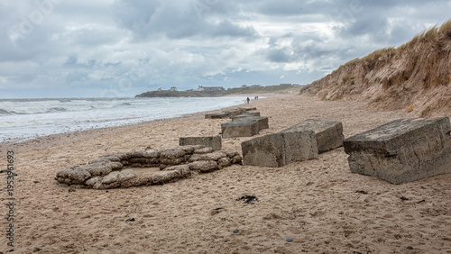 World War Two coastal defence concrete blocks and gun placement on Seaton Sluice Beach, Northumberland, England. Uncovered following a storm that swept the sand away.