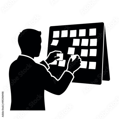 Man organizing sticky notes on a calendar board.