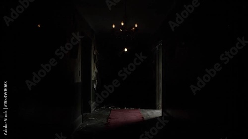 An eerie, abandoned hallway with peeling wallpaper and a flickering chandelier, leading into a dark unknown void, evokes unsettling mystery.