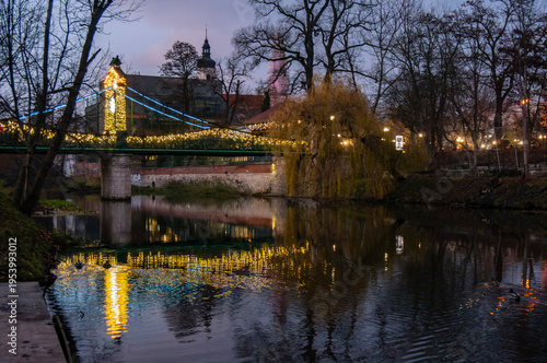 Młynówka Canal in evening, Penny Bridge (Most Groszowy), illumination. Opole, Poland.