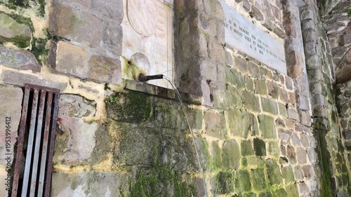 Old stone fountain in Perdifumo village Cilento Italy, historic water source traditional architecture detail