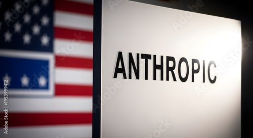 Close-up of sign with 'ANTHROPIC' text beside American flag