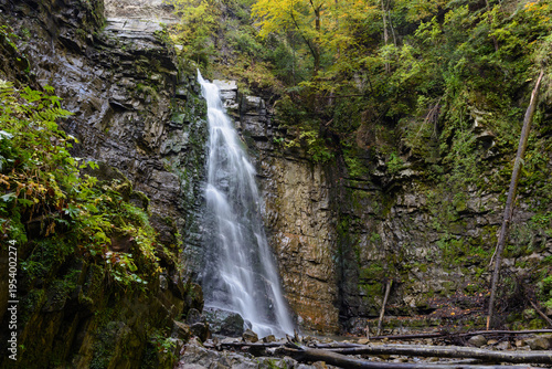 Maniavskyi waterfall in Maniava, Cascade in forest in mountains. Carpathian Mountains, Ivano-Frankivska oblast, Ukraine.