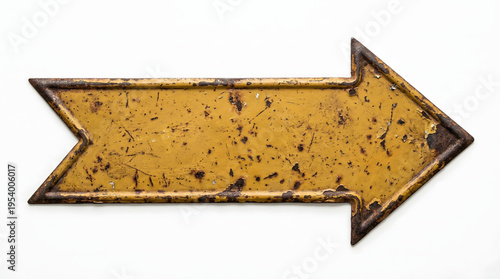 A close-up of a rusty yellow arrow sign pointing to the right on a white background