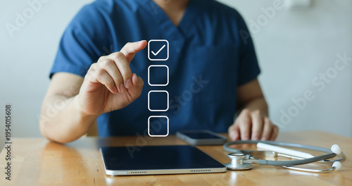 close up young general practitioner hand check box on medical chekclist or opd record to read and diagnose and assess about patient's symptom for healthy and lifestyle concept