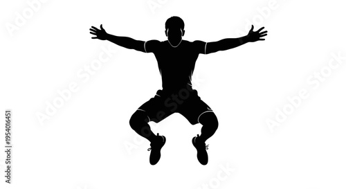 Silhouette of an Athletic Man Jumping with Arms Outstretched