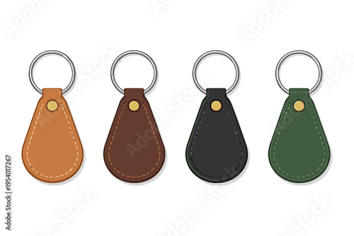 Set of four leather keychain tags in different colors with metal rings on a white background