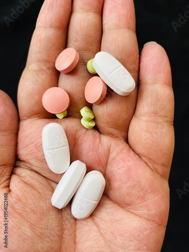 Принти на полотні Health care of sickness, illness asian young woman, girl hand holding, take pills capsule, painkiller medicine for flu, headache pain for treatment, take drug or vitamin at home