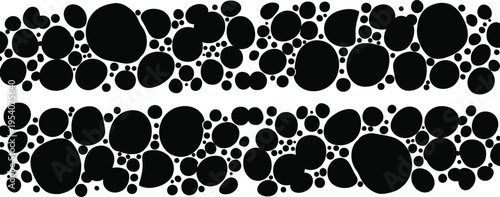 Silhouette of various sized black circles on white background silhouette