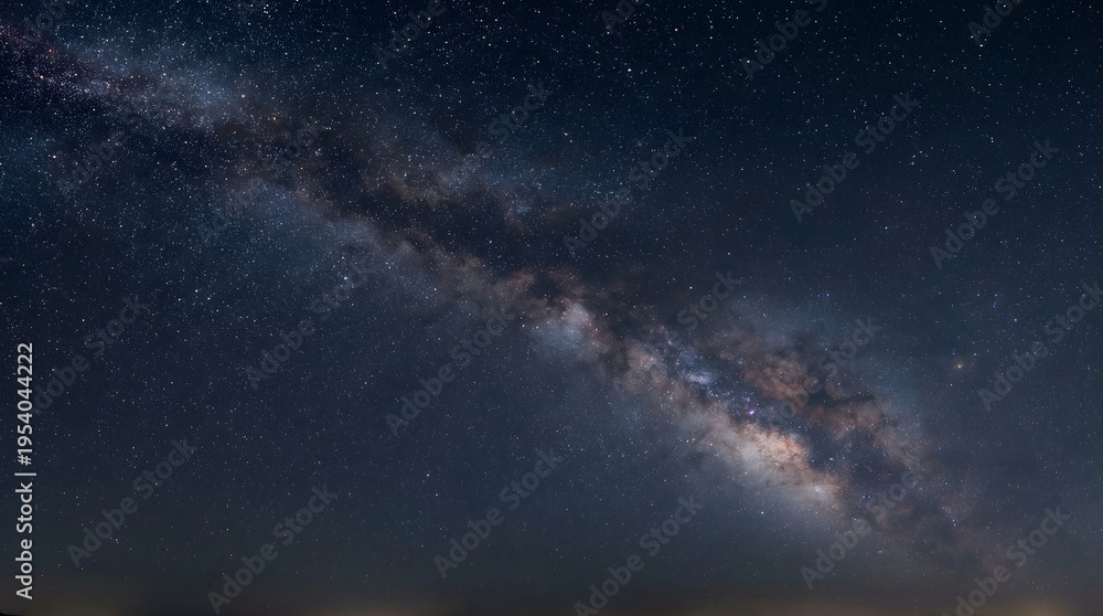 Fototapeta premium Milky Way Galaxy Stretching Across Night Sky with Stars and Cosmic Landscape