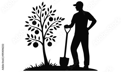 Man standing beside a fruit tree with a shovel in hand