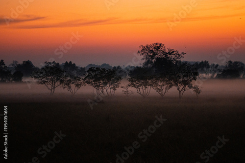 Sunrise over rural farmland...