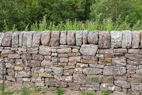 Photography A gritstone (millstone grit) dry stone wall in the Peak District National Park a