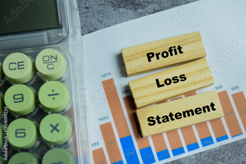 Concept of text profit and loss statement on wooden blocks. Representing financial performance evaluation