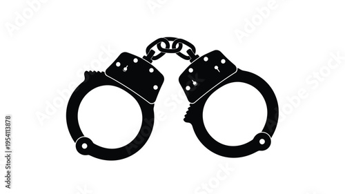 Black metal handcuffs shown in a stark dramatic silhouette