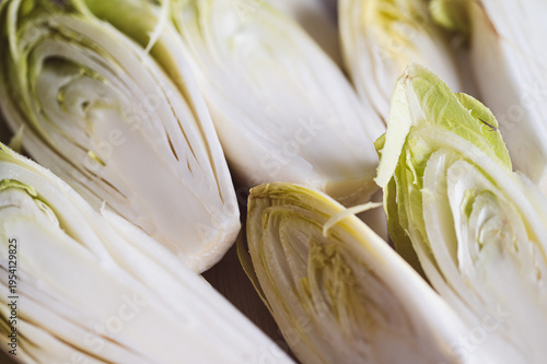 Vászonkép Fresh Belgian endive heads sliced in half, ready for salad preparation,Organic c