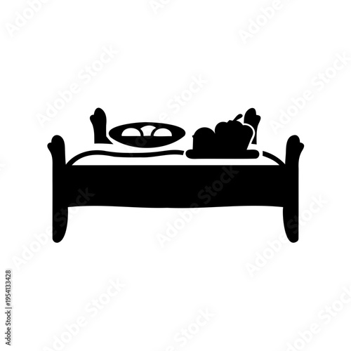 Vector silhouette of a bed with breakfast items