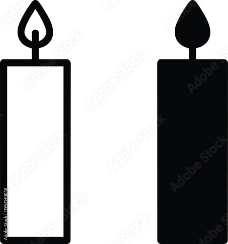 Two minimalist candles one black one white with lit flames