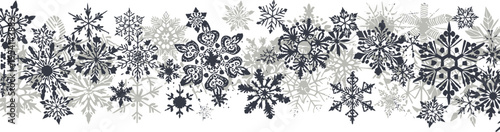 Horizontal border of diverse snowflakes in grey and black for winter holiday designs