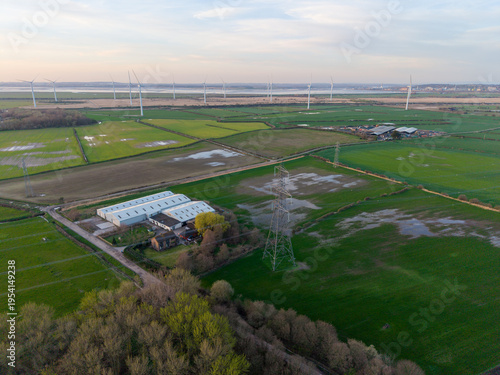 Aerial View of Wind Farm, Power Pylons and Rural Industry, England