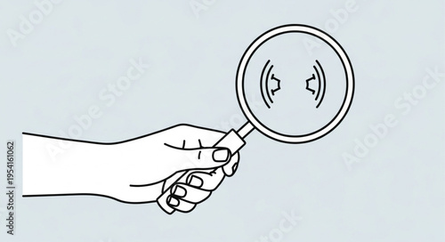 Hand holding magnifying glass focusing on brackets, symbol of focus and attention.