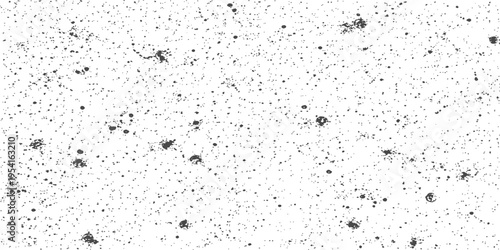 A high contrast black and white texture featuring a dense pattern of scattered irregular ink dots