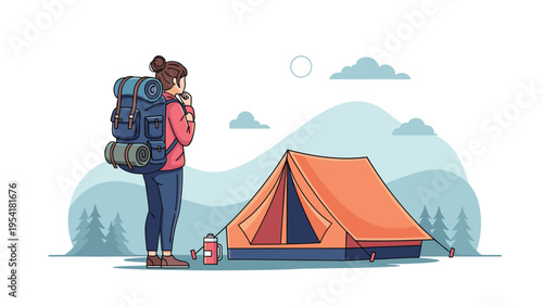 Female hiker with a large backpack standing in front of an orange tent in a mountainous landscape at beautiful sunrise.