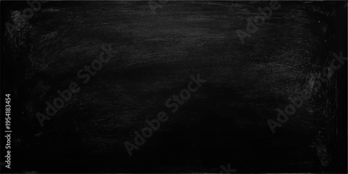 An empty vintage blackboard with a dark grunge texture and a weathered grey stone surface set within an old blank frame for a dirty chalkboard backdrop