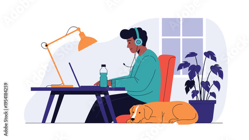Young man working on laptop at desk in cozy home office with dog lying faithfully at his feet.