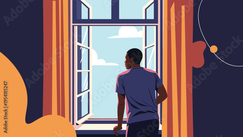 Man in a blue t-shirt seen from behind looking out of a large open window at a bright blue sky with white clouds from inside a room.