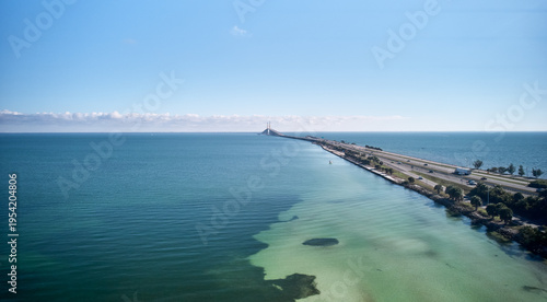 Aerial image of the highway leading up to the Sunshine Skyway Bridge over Tampa Bay linking Pinellas and Manatee County