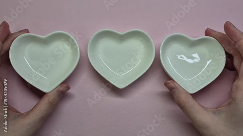 Serving three heart shape plates, small plates, boul for snacks, celebrating valentines day