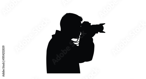 Photographer capturing a moment with a camera striking black form silhouette