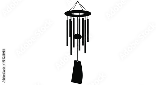 Black wind chime hangs against a white background a striking silhouette