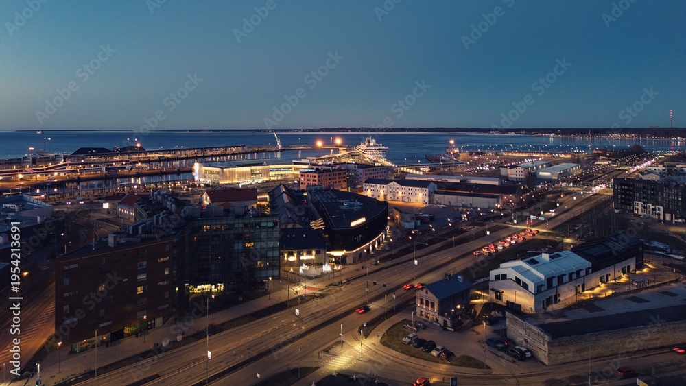 Fototapeta premium Drone View of Tallinn Harbor and Modern Cityscape at Dusk