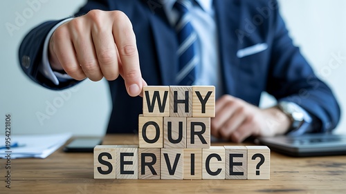 Business professional arranging wooden blocks spelling out why our service question