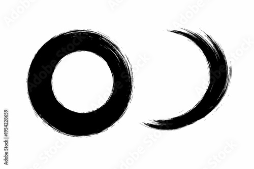 Two abstract black ink brush strokes forming circles on a white background