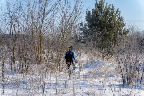 Wallpaper Mural woman hiker walking through frosty snow covered landscape Torontodigital.ca