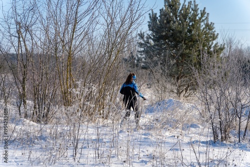 Wallpaper Mural woman hiker walking through frosty snow covered landscape Torontodigital.ca