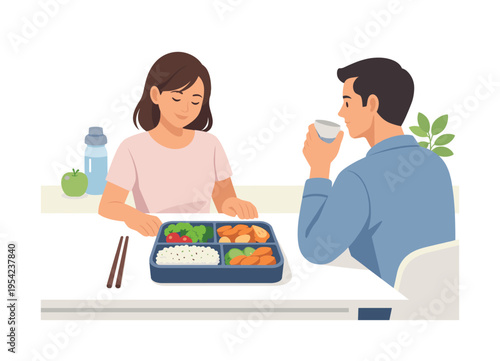 Healthy everyday meal preparation and balanced nutrition in a modern lifestyle context, a neatly arranged bento box lunch placed on a table with visible compartments containing