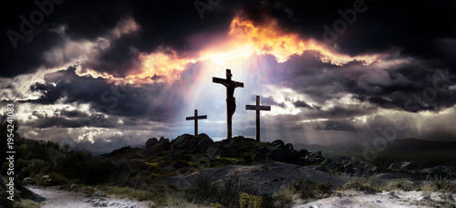 Calvary Hill - Crucifixion Of Jesus - Three Crosses With Dramatic Clouds …and there was darkness over the whole land... Sunbeam Flare And Glittering Effects On Christ 
