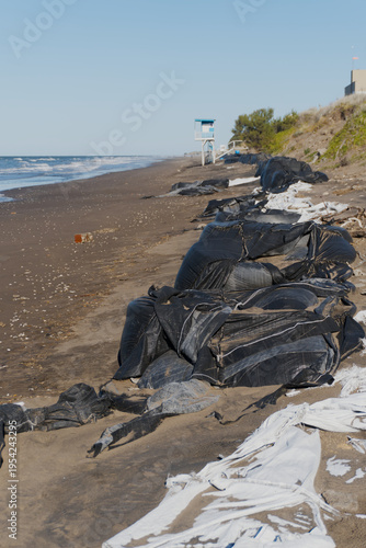 Coastal beach erosion barrier protecting coastline from climatic change