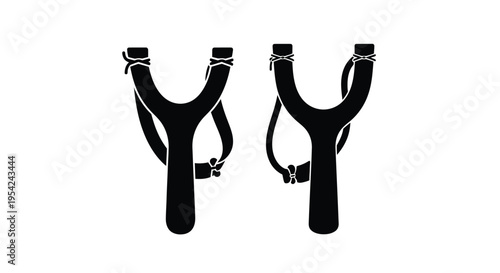 Two black silhouettes of classic slingshots displayed against a white background