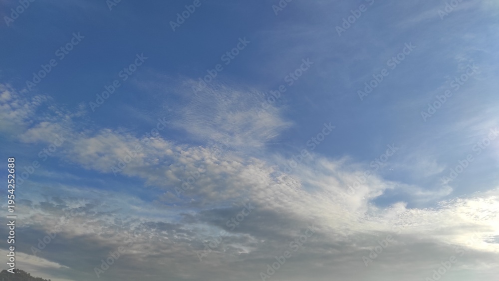 Obraz premium Natural Bright blue sky wide White soft Cloud : Clear Summer Day Light, cloudy Nature Beauty texture, Natural beautiful sky blue with cloud, dark clouds, blue clouds above the roof tiles.