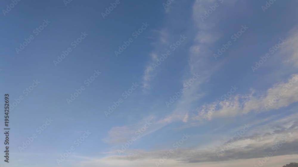 Obraz premium Natural Bright blue sky wide White soft Cloud : Clear Summer Day Light, cloudy Nature Beauty texture, Natural beautiful sky blue with cloud, dark clouds, blue clouds above the roof tiles.