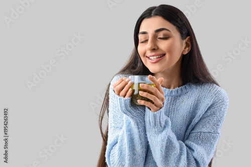 Happy young woman with glas...